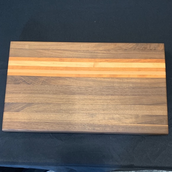 Handcrafted one of a kind Black Walnut Maple and Paddock Cutting Board
